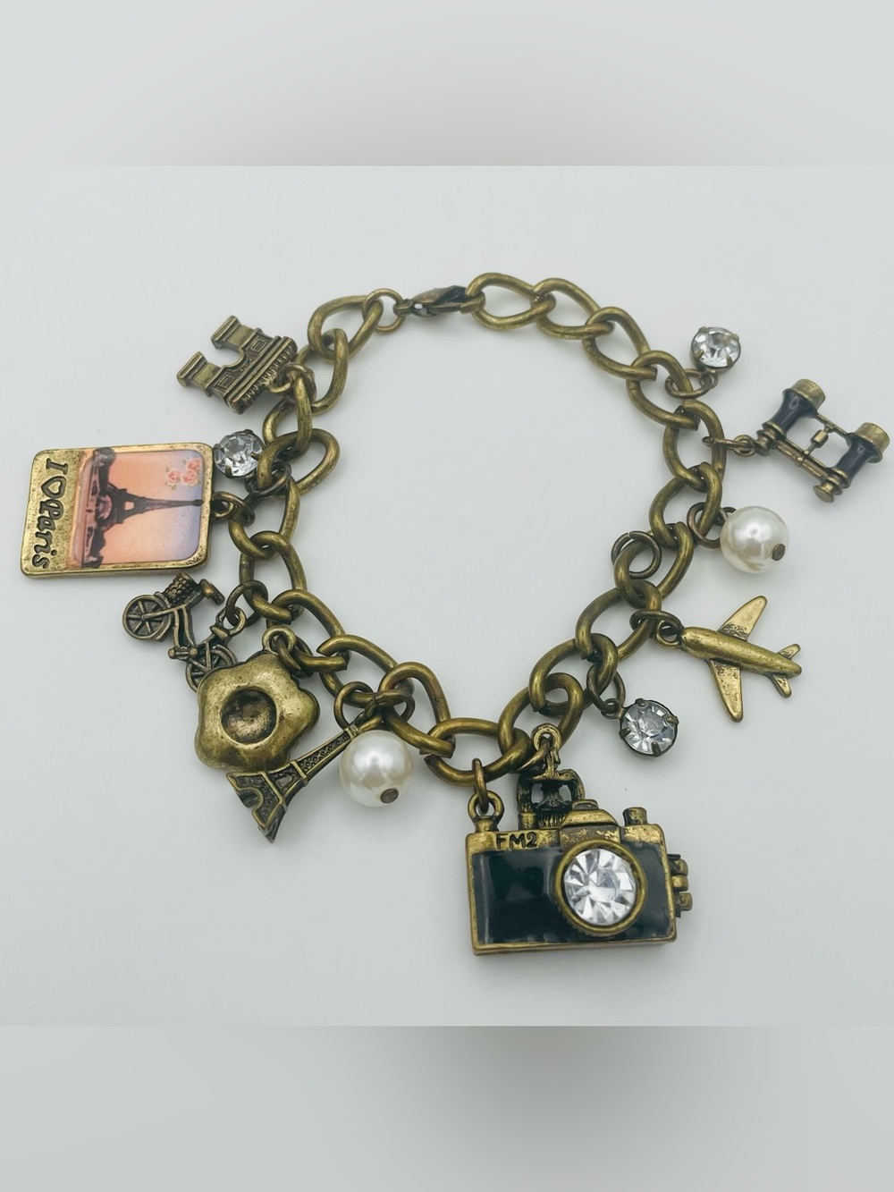 Claire's Paris Charm Bracelet. Brass Tone. Camera, Eiffel Tower. Plane. 7 inches